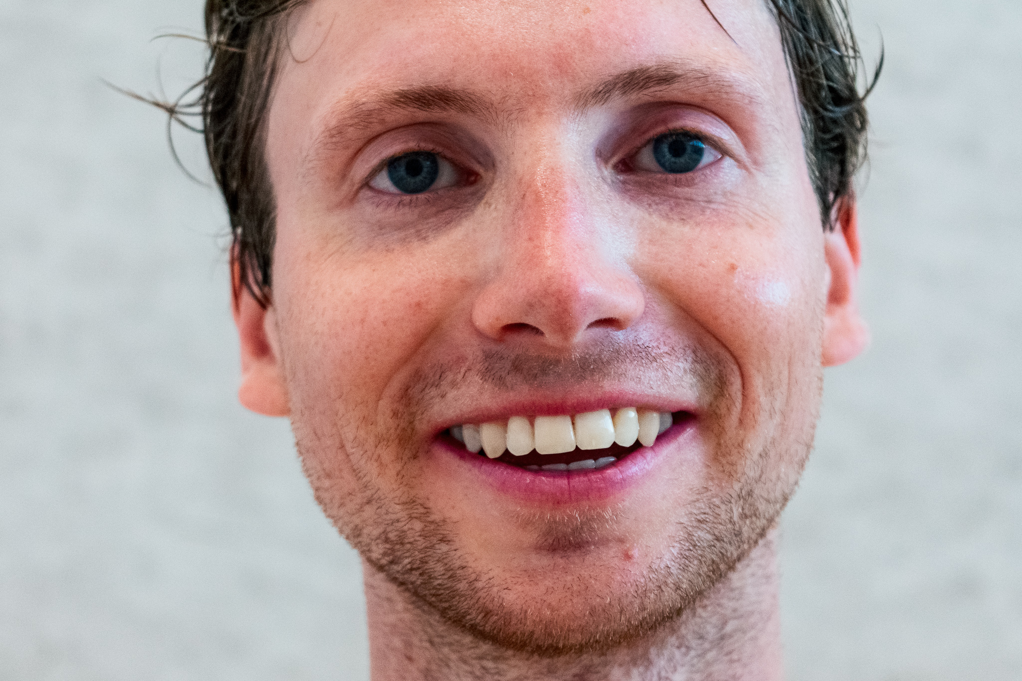 Close-up portrait of a smiling squash player after a game