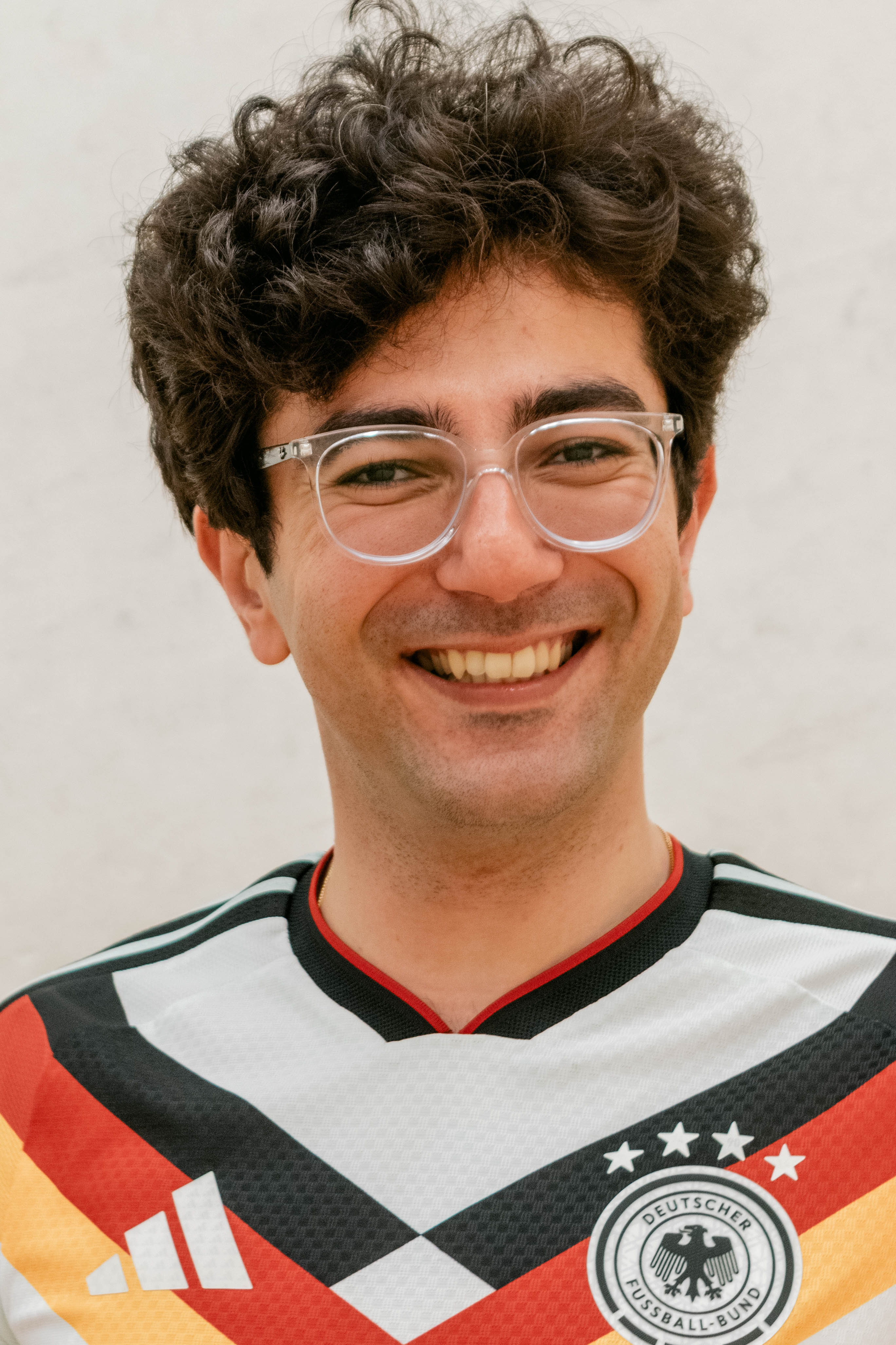 Smiling portrait of a man in a Germany sports shirt